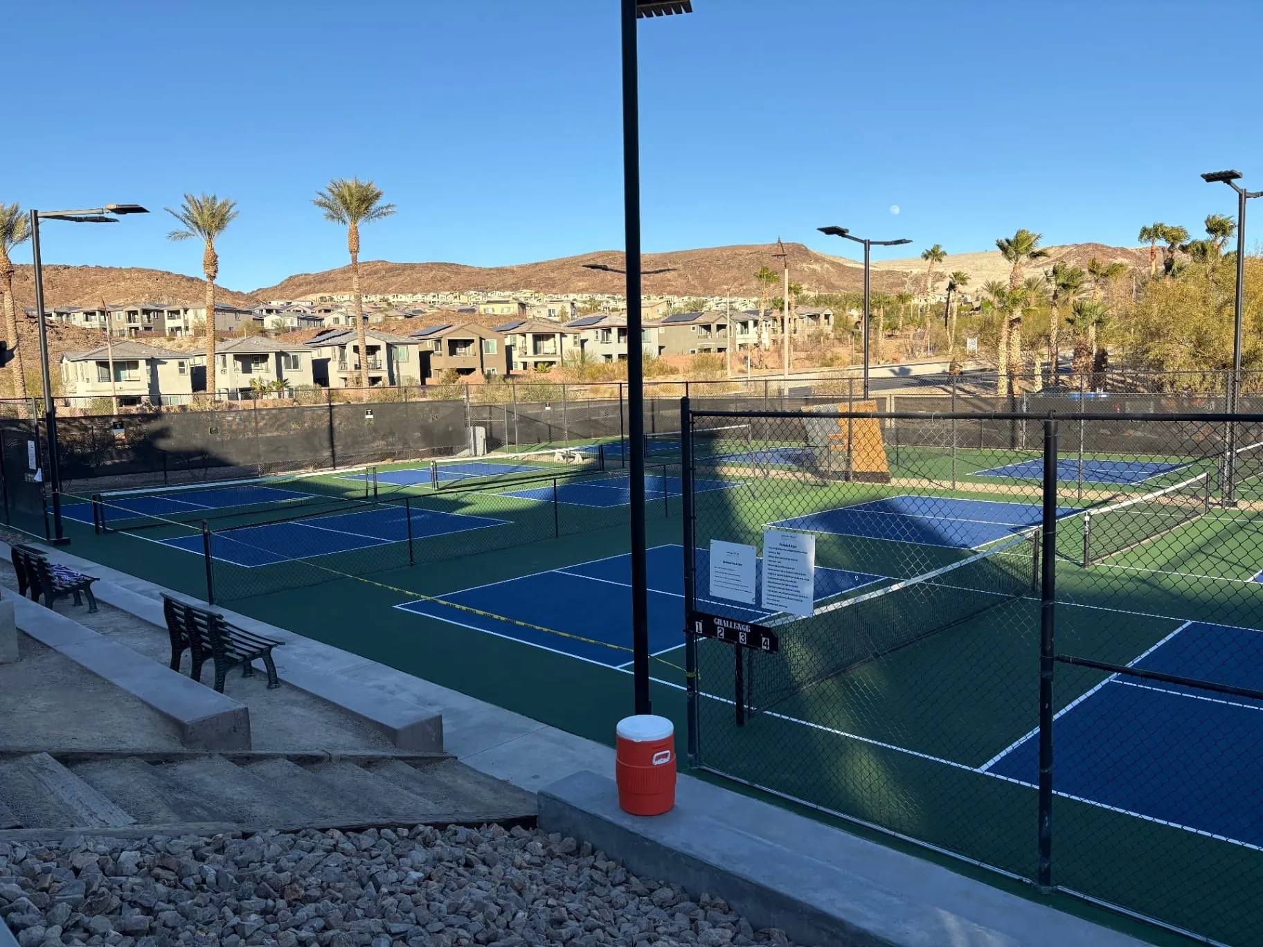 Newly resurfaced blue and green pickleball courts at a community facility in Lake Las Vegas